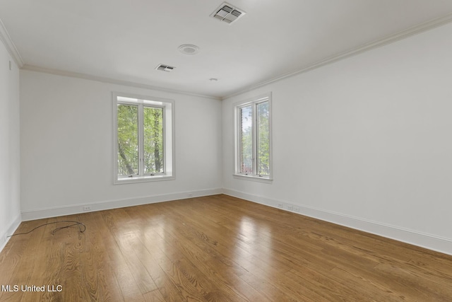 13 Highland Meadows Dr, Jackson, MS 39211 - spare room with crown molding, healthy amount of natural light, and wood finished floors