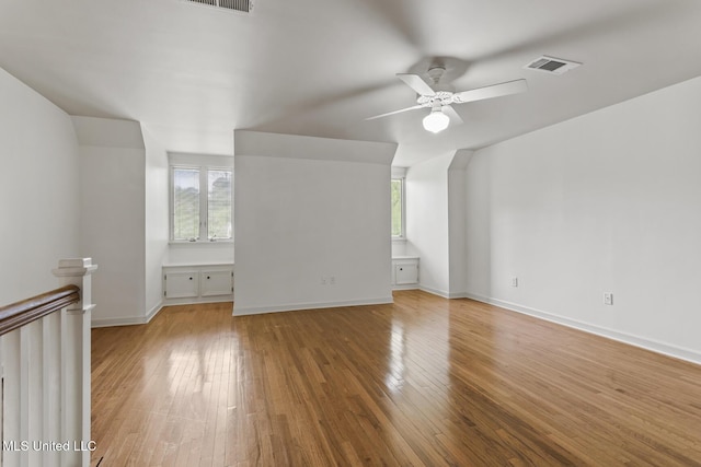 13 Highland Meadows Dr, Jackson, MS 39211 - unfurnished room featuring light wood finished floors, plenty of natural light, and a ceiling fan