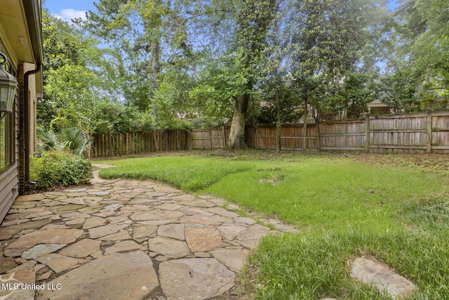 13 Highland Meadows Dr, Jackson, MS 39211 - fenced backyard with a patio