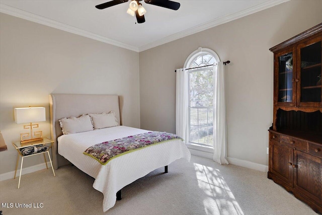 bedroom with light carpet, a ceiling fan, crown molding, and baseboards