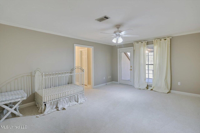 unfurnished bedroom featuring visible vents, crown molding, and baseboards