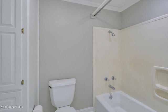 bathroom with crown molding, toilet, and bathing tub / shower combination