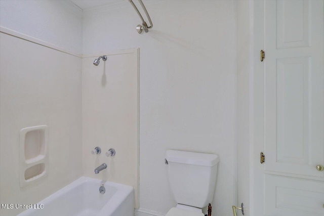 bathroom with shower / bathing tub combination and toilet