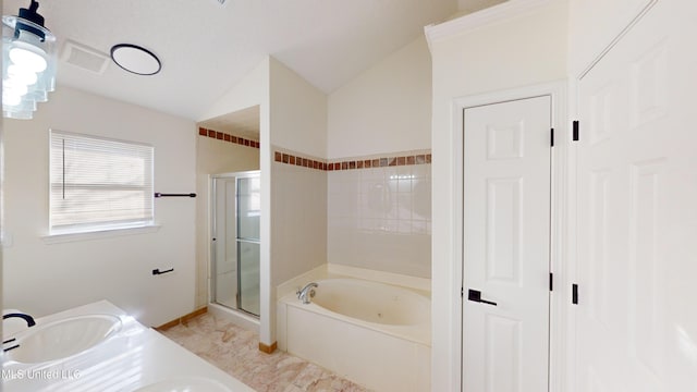 bathroom with lofted ceiling, vanity, and shower with separate bathtub