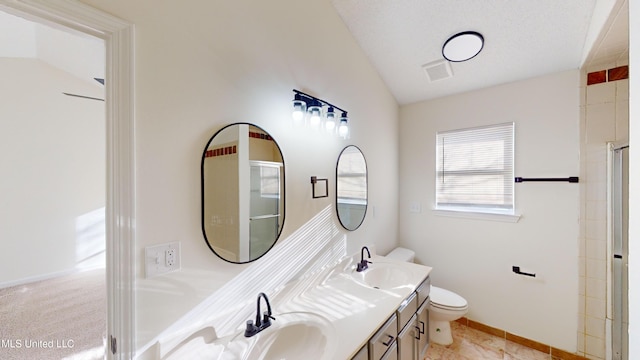 bathroom featuring lofted ceiling, vanity, toilet, and an enclosed shower