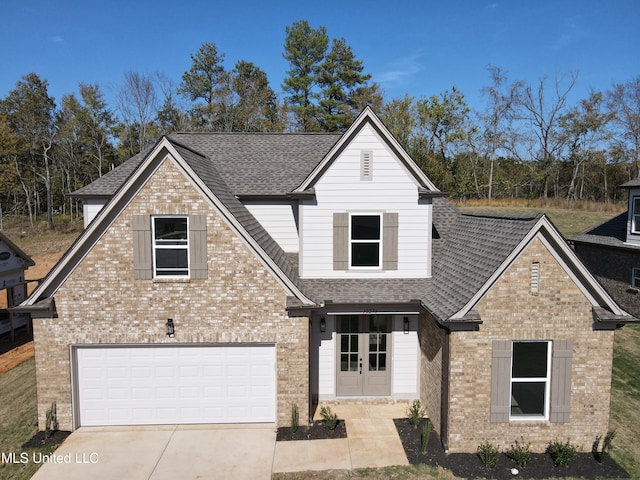 117 Centerline Roper Loop, Byhalia, MS 38611 - view of front facade with brick siding, a shingled roof, and concrete driveway