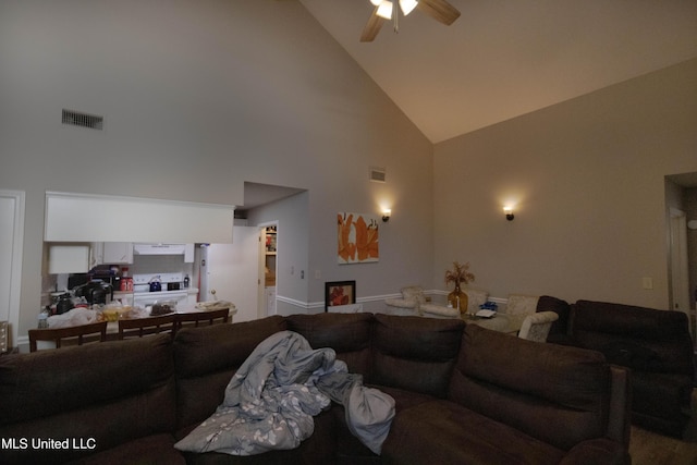 living room featuring ceiling fan and high vaulted ceiling