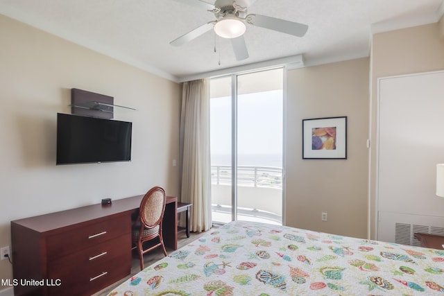 2060 Beach Blvd Unit 1602, Biloxi, MS 39531 - bedroom with access to outside, a desk, a ceiling fan, and expansive windows