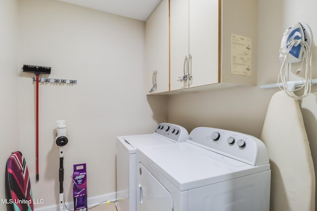 2060 Beach Blvd Unit 1602, Biloxi, MS 39531 - laundry area with washer and clothes dryer, cabinet space, and baseboards