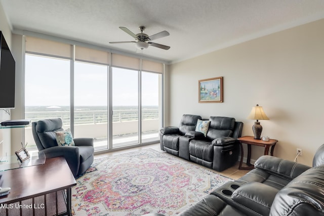 2060 Beach Blvd Unit 1602, Biloxi, MS 39531 - living area with ceiling fan, expansive windows, and tile patterned floors