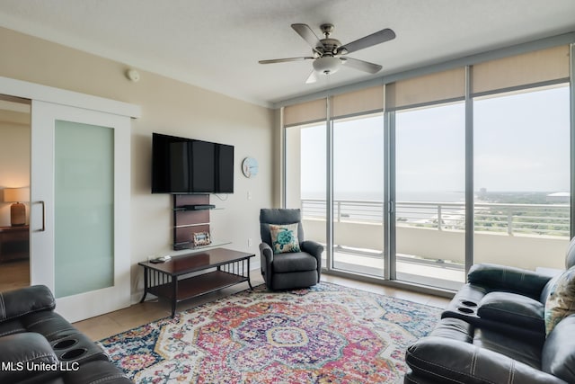 2060 Beach Blvd Unit 1602, Biloxi, MS 39531 - living room with light tile patterned floors and ceiling fan