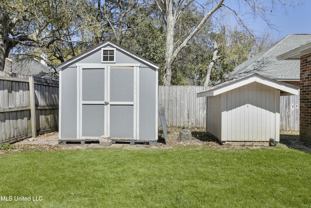 view of shed featuring a fenced backyard