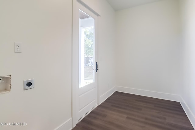 doorway to outside featuring dark wood-type flooring