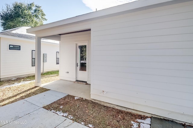 property entrance with a patio area