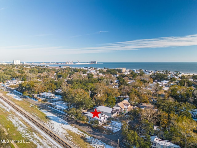 drone / aerial view with a water view and a beach view