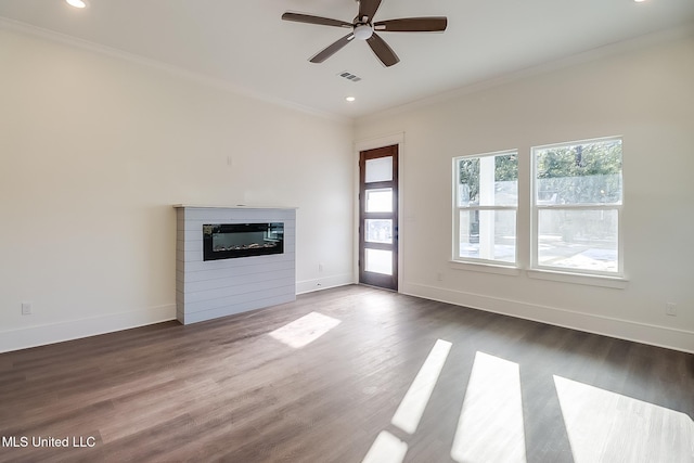 unfurnished living room with dark hardwood / wood-style flooring, crown molding, and ceiling fan