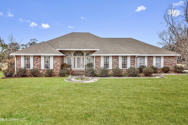 single story home featuring a front lawn