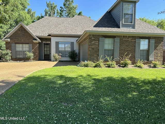 153 Bradfield Rd, Gluckstadt, MS 39110 - view of front of house featuring brick siding, an attached garage, and roof with shingles