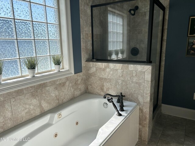 153 Bradfield Rd, Gluckstadt, MS 39110 - full bathroom with a stall shower, a tub with jets, and baseboards