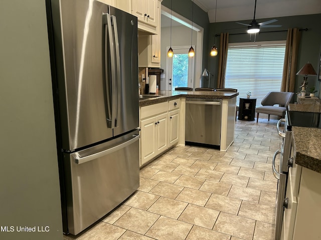 153 Bradfield Rd, Gluckstadt, MS 39110 - kitchen with appliances with stainless steel finishes, dark countertops, a peninsula, hanging light fixtures, and ceiling fan