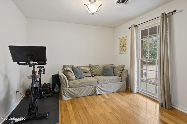 workout area with wood-type flooring