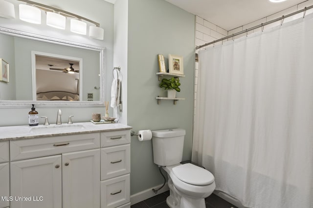 bathroom with ceiling fan, vanity, and toilet