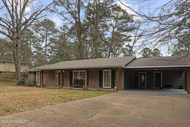 ranch-style home with a carport and a front yard