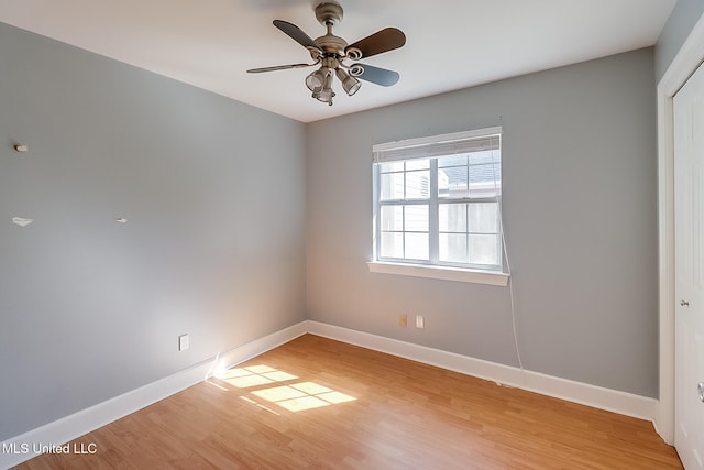 empty room featuring light hardwood / wood-style flooring and ceiling fan