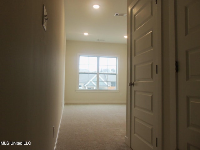 corridor with light carpet