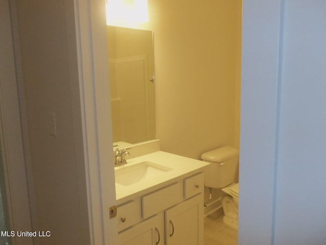 bathroom with vanity and toilet