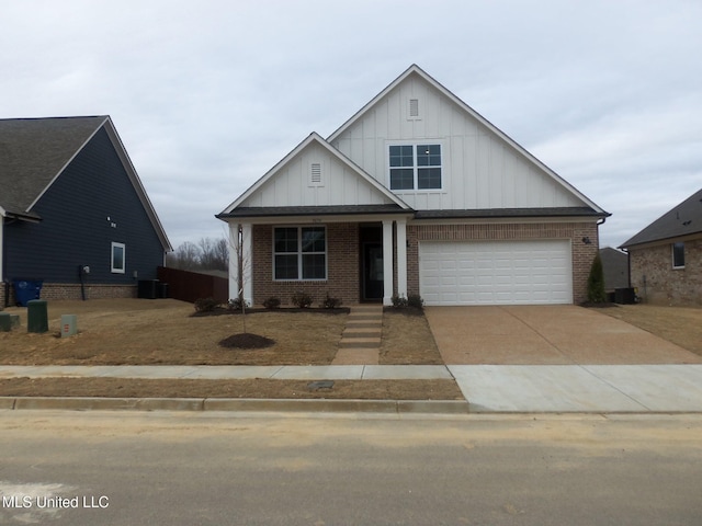 view of front of house with cooling unit and a garage