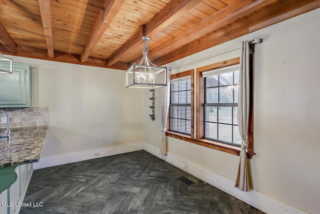 unfurnished dining area featuring beam ceiling, dark parquet flooring, wooden ceiling, and an inviting chandelier