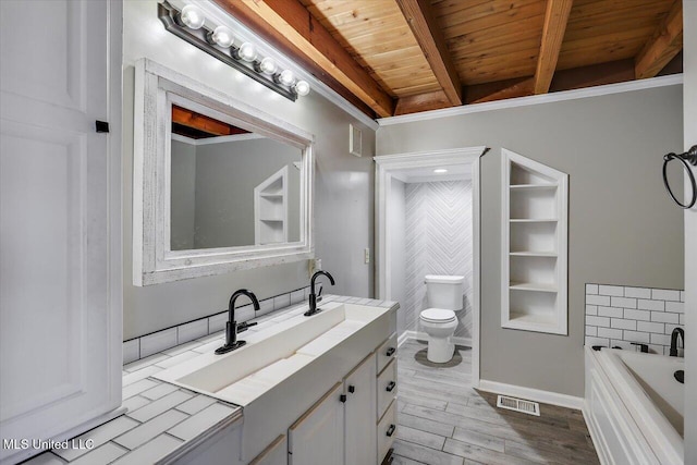 bathroom with beam ceiling, a tub to relax in, hardwood / wood-style floors, and wood ceiling