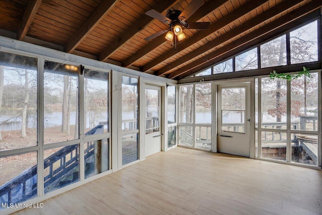 unfurnished sunroom featuring vaulted ceiling with beams, ceiling fan, a water view, and wood ceiling