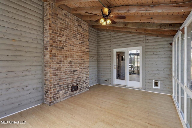 unfurnished sunroom featuring vaulted ceiling with beams, ceiling fan, and wooden ceiling