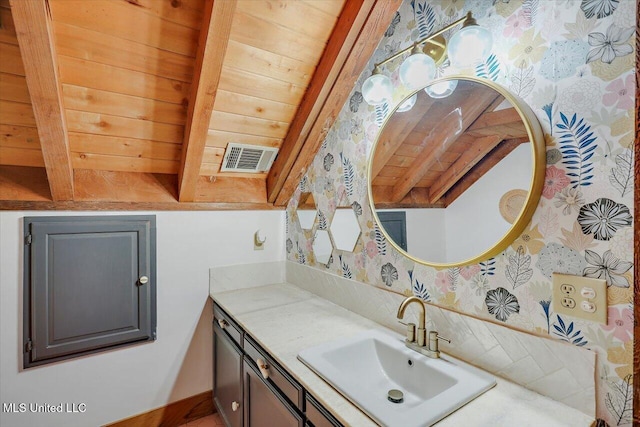 bathroom featuring beamed ceiling, vanity, and wood ceiling