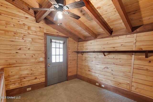 doorway featuring ceiling fan, wooden ceiling, lofted ceiling with beams, carpet floors, and wooden walls