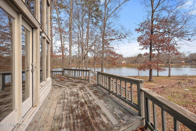 wooden terrace with a water view