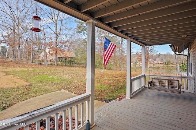 wooden deck with a yard