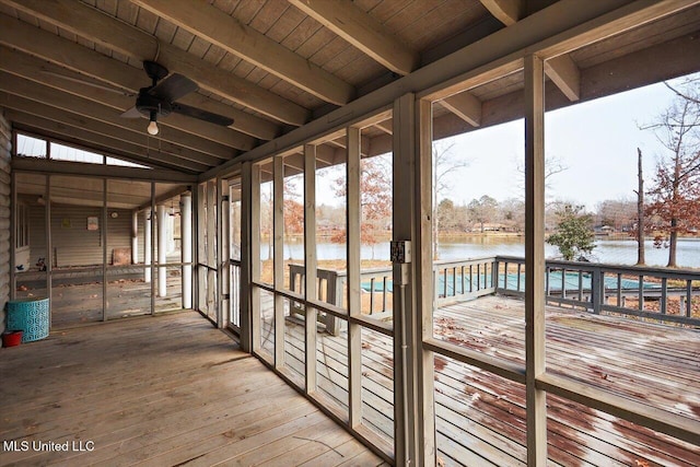 interior space featuring ceiling fan, lofted ceiling with beams, a water view, and wood ceiling