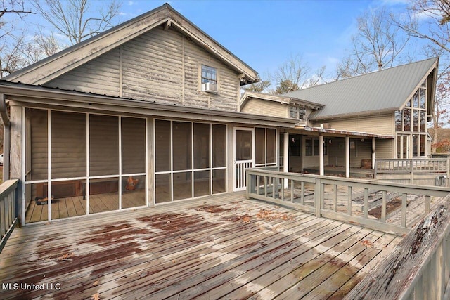 wooden terrace with a sunroom