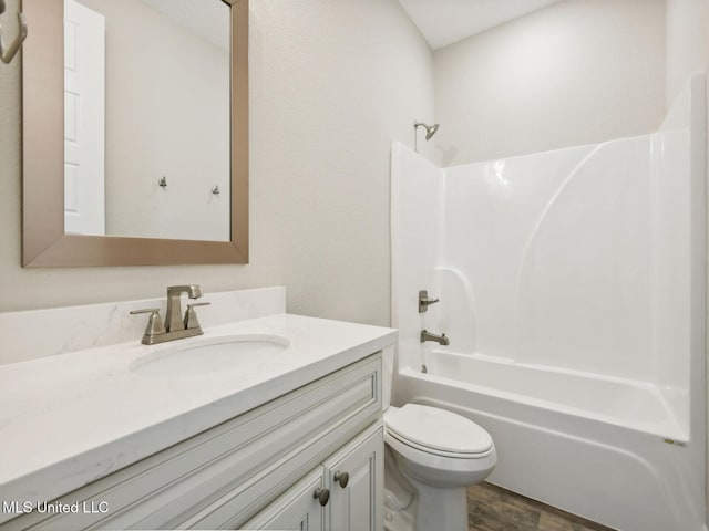 130 Everly Cir, Ocean Springs, MS 39564 - bathroom featuring wood finished floors, shower / bath combination, vanity, and toilet