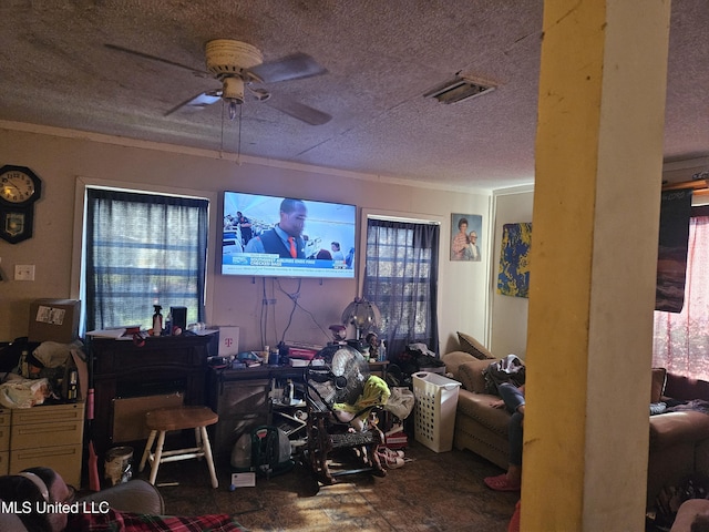8800 Graham Rd, Moss Point, MS 39562 - living area featuring ceiling fan and a textured ceiling