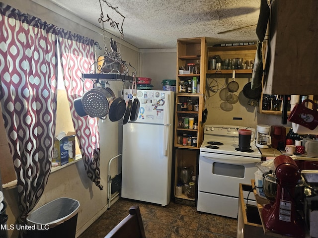 8800 Graham Rd, Moss Point, MS 39562 - kitchen featuring white appliances and a textured ceiling
