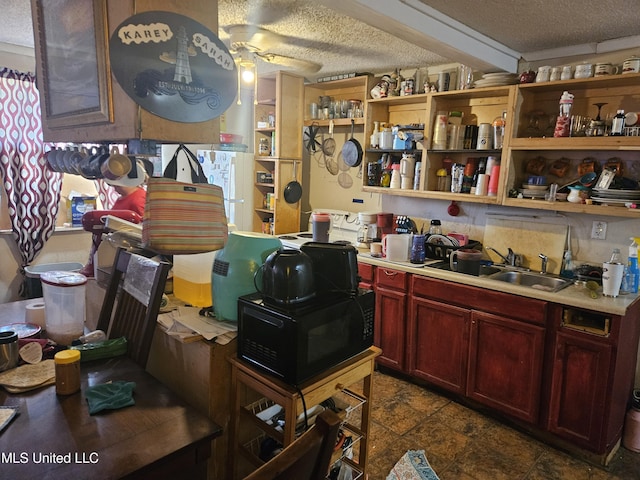 8800 Graham Rd, Moss Point, MS 39562 - bar with a textured ceiling, a sink, black microwave, and ceiling fan