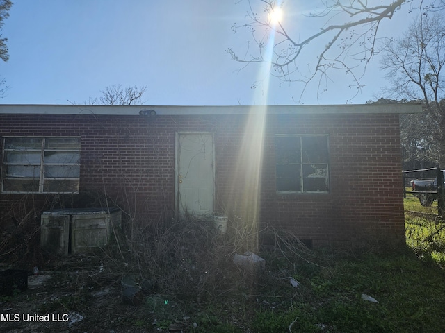 8800 Graham Rd, Moss Point, MS 39562 - view of side of home featuring brick siding, crawl space, and central air condition unit