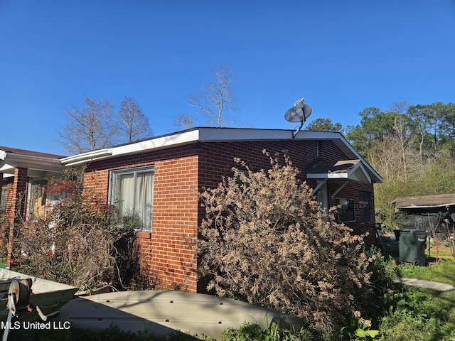 8800 Graham Rd, Moss Point, MS 39562 - view of side of home featuring brick siding
