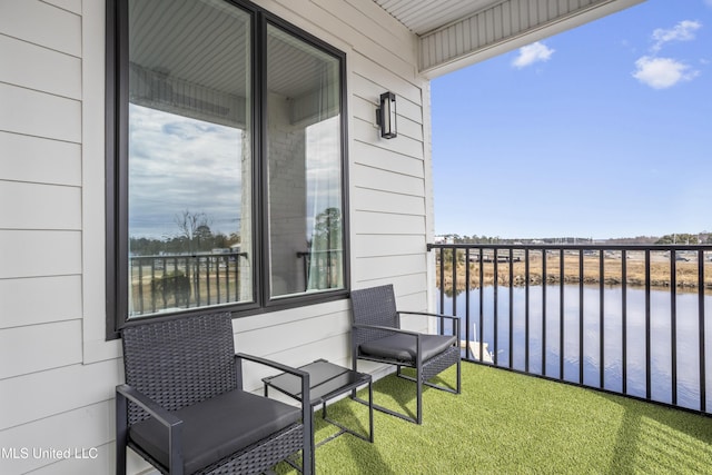 balcony featuring a water view