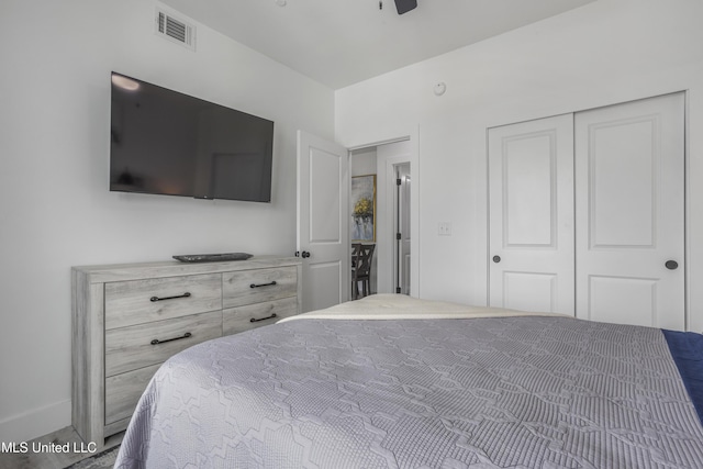 bedroom featuring visible vents and a closet