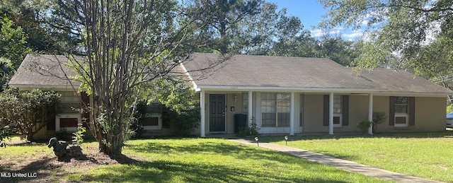 view of front of home with a front yard and a porch